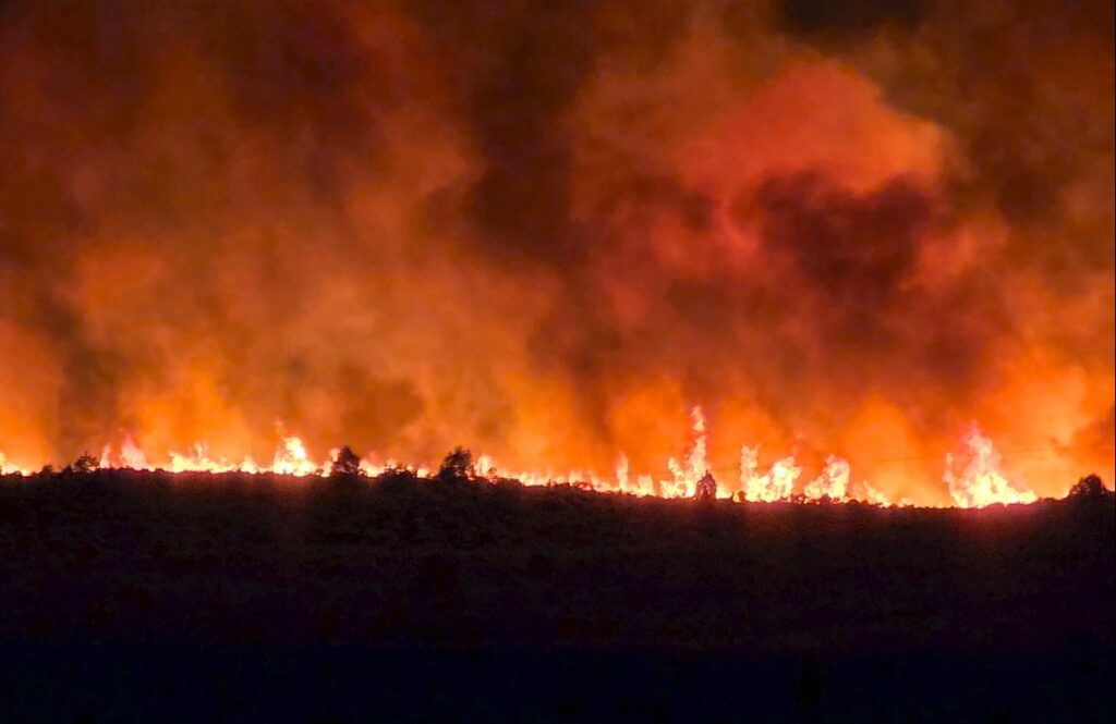Fire along ridge during the night