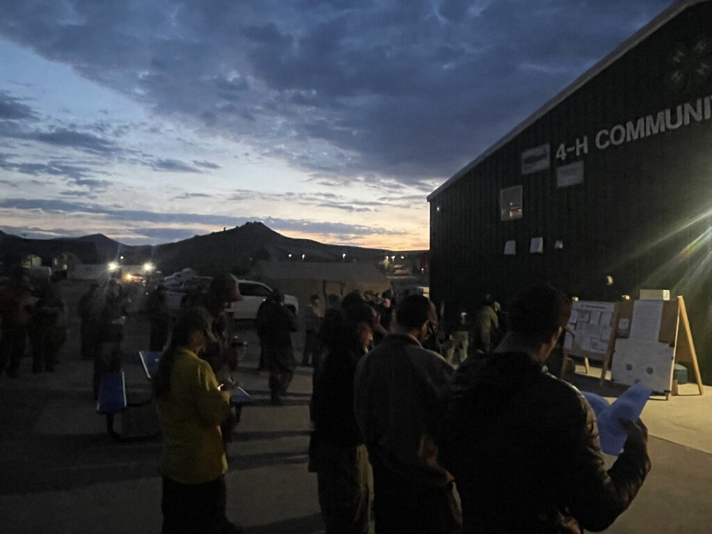 People gather during an informational meeting on the Lee and Elk fires. 