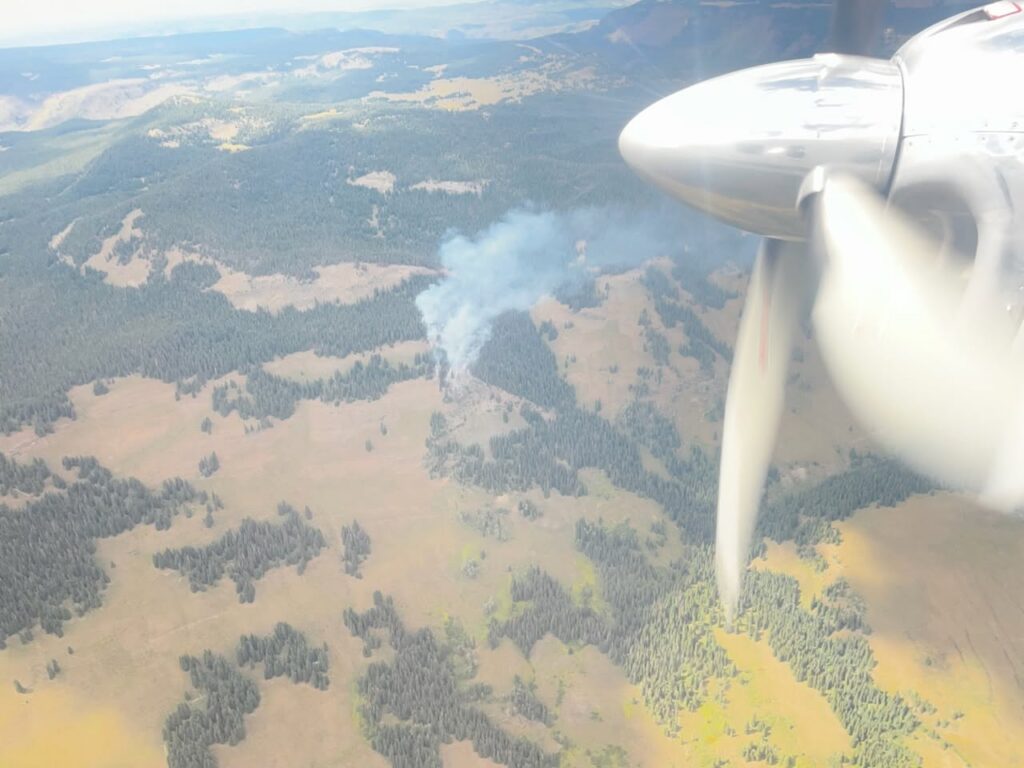 Elk Knob Fire in Flat Tops shows smoke plume in aircraft image