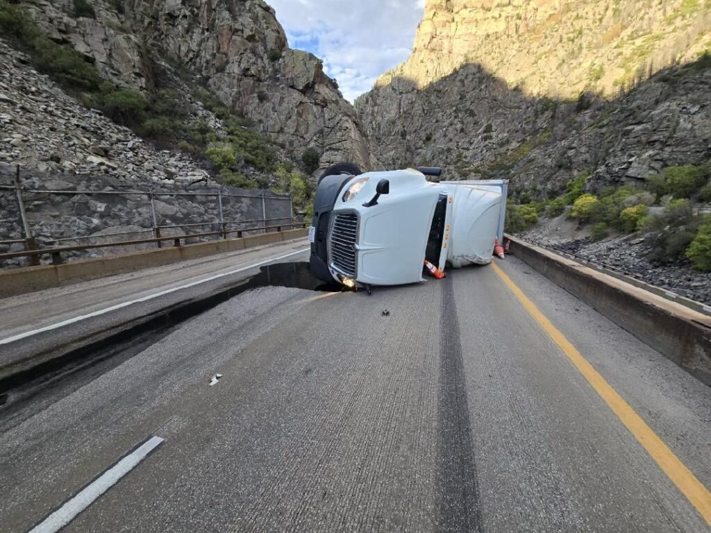 Front of commercial vehicle on side on I-70