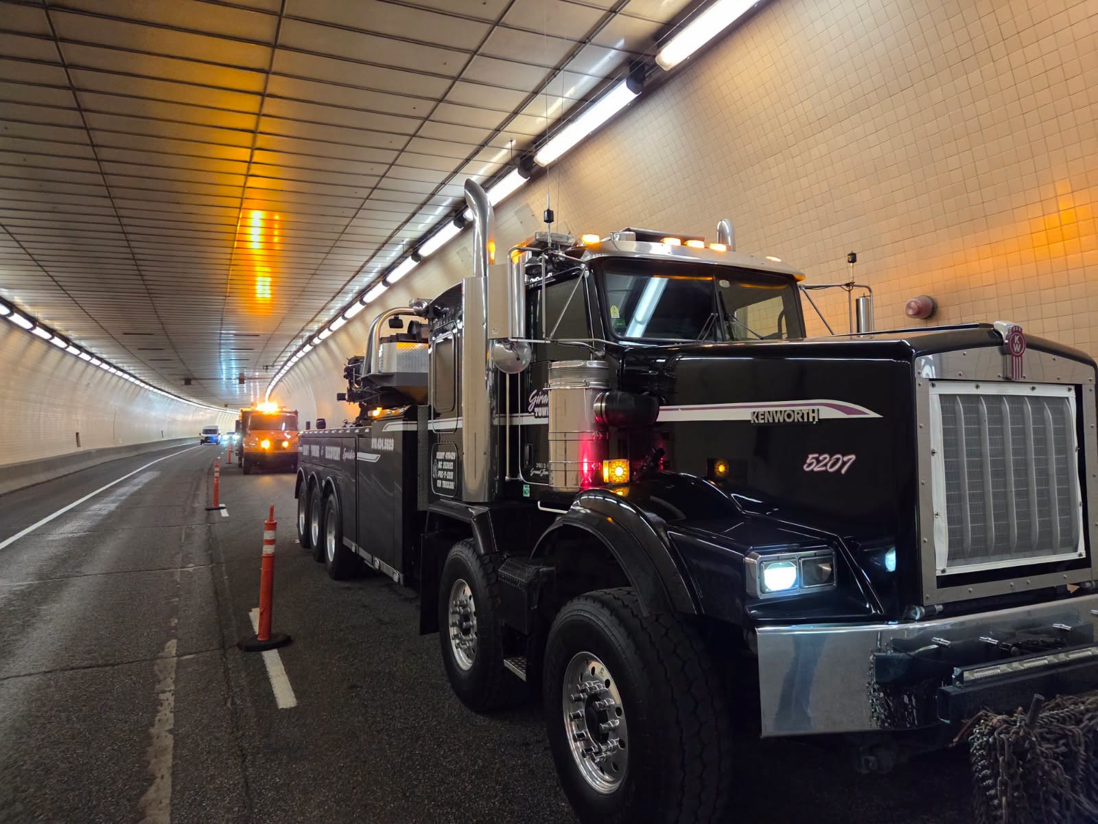 truck in closed lane of hanging lake tunnel on I70