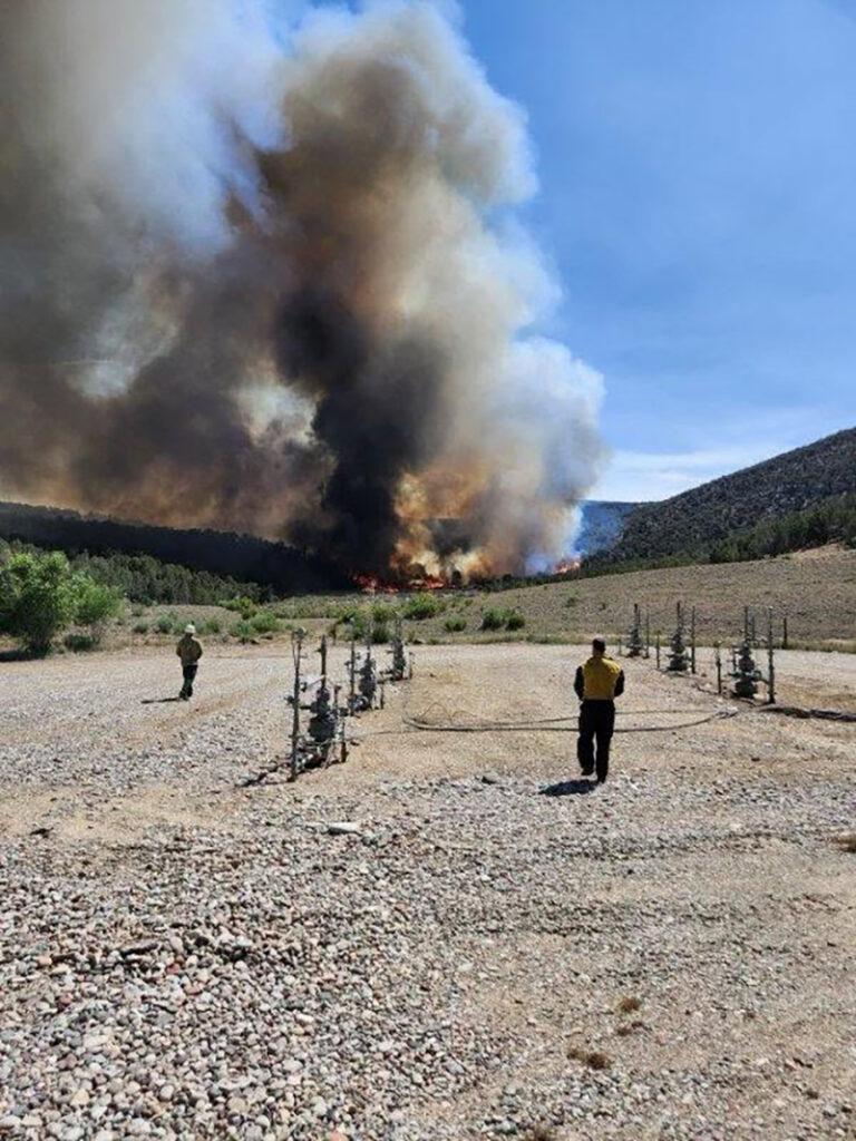 Emergency services respond to the Dry Creek Fire by natural gas facilities.